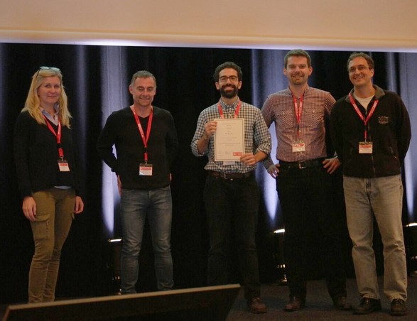 Ali Osman Ulusoy, Andreas Geiger and Michael Black receive 3DV 2015 Best Paper Award